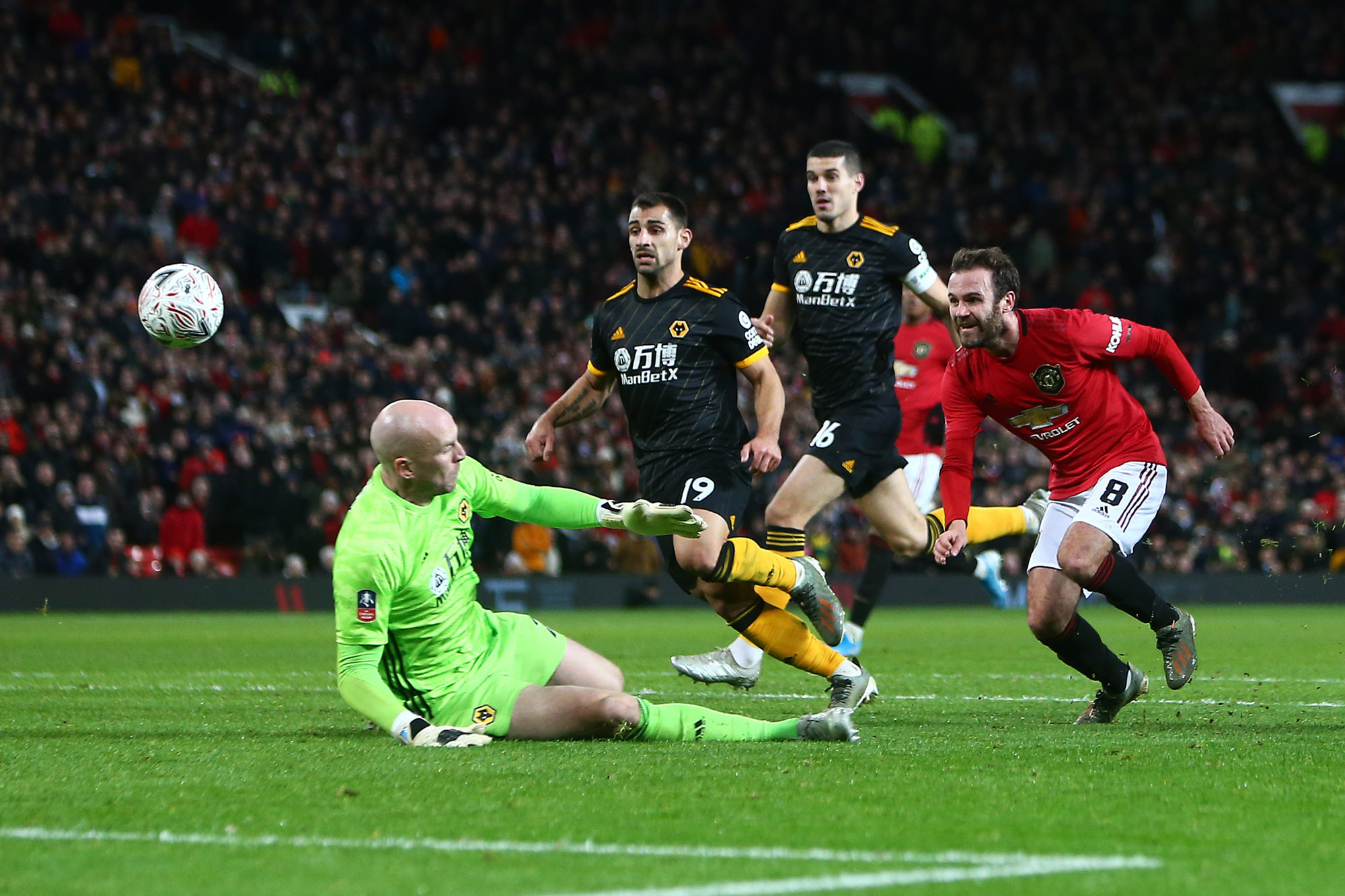 Juan Mata of Manchester United scores the opening goal