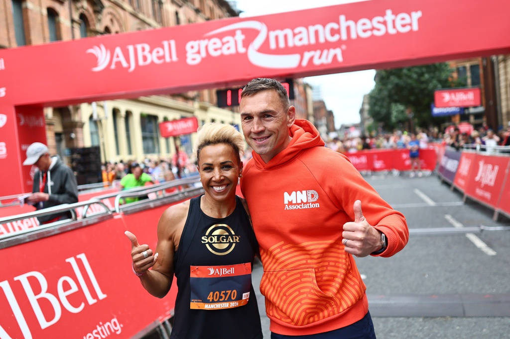 Former athlete Dame Kelly Homes and former rugby league player Kevin Sinfield take part in the Great Manchester Run 2026